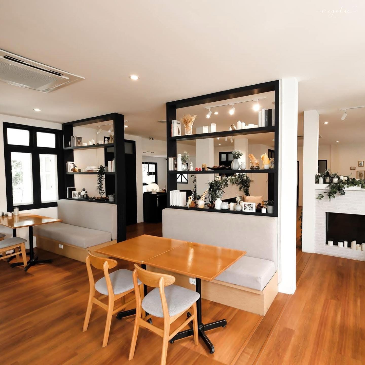 Ryoku Cafe interior with warm wood tables and display shelves