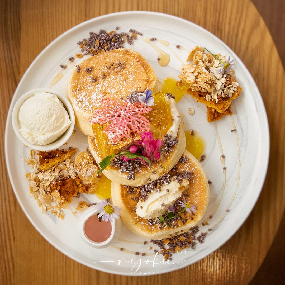 Souffle pancake being served on a wood table at Ryoku Cafe